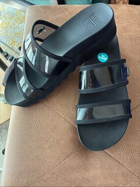 Women’s plateau Black Slide Sandals with Clear Straps - brand new Reef!